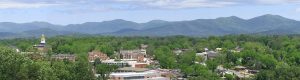 A panaroma of the University of north georgia, with the mountains and trees in the background