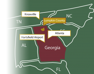 A map showing lumpkin county in relation to Atlanta, Hartsfield Jackson International Airport, Port of Savannah, Alabama, South Carolina, North Carolina and Tennessee.